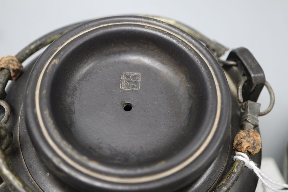 A Chinese enamelled Yixing teapot, height 13cm and a black Yixing teapot
